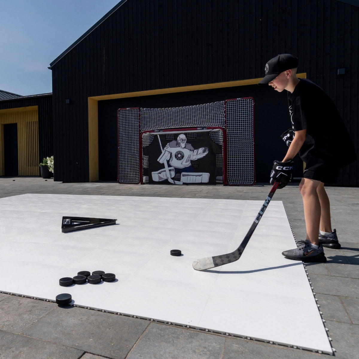Kids playing off-ice hockey games on Better Hockey training tiles